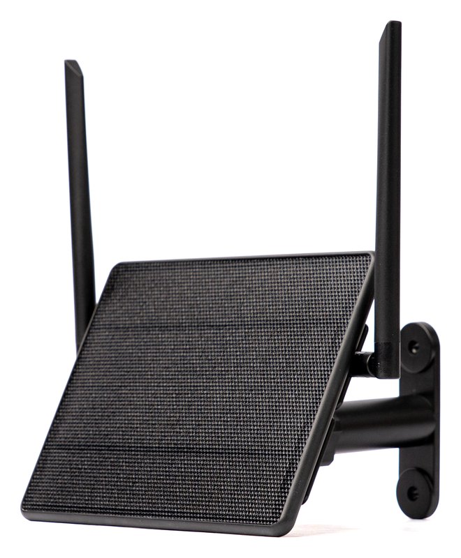 A ThinkNode M6 Solar, a black weatherproof box with a solar panel across its face and two antennas standing up behind it, on an angled wall-mount bracket.