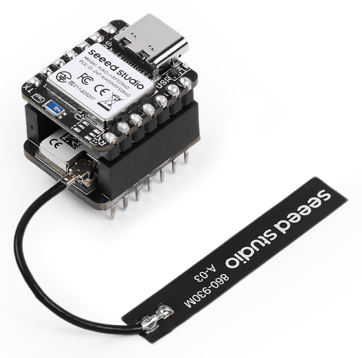 A Seeed XIAO nRF52840 stacked on a Wio-SX1262 board, a stack about the size of a thumbnail, with a flat flexible LoRa antenna on a short lead.